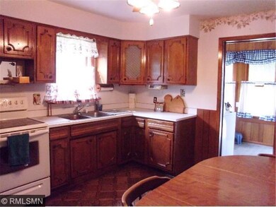 View of kitchen from living room to back porch