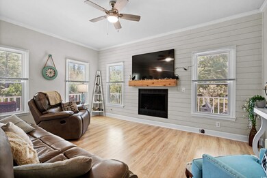 Living room featuring a fireplace, light hardwood 