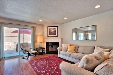 A spacious living room with fireplace and access t