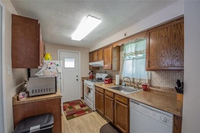 Nice roomy kitchen which leads out to covered porc