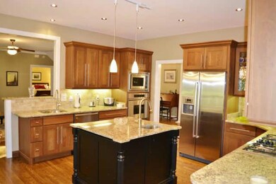 Beautiful Granite, Veggie Sink In The Center Island, High End Stainless Steel Appliances.