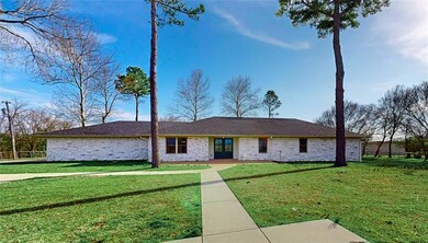 Single story home featuring a front lawn