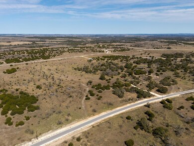 Birds eye view of property featuring a rural view