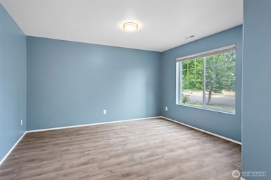 Large window allows for natural lighting to flood the front Formal Living room.
