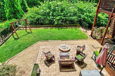 Fenced backyard with a patio