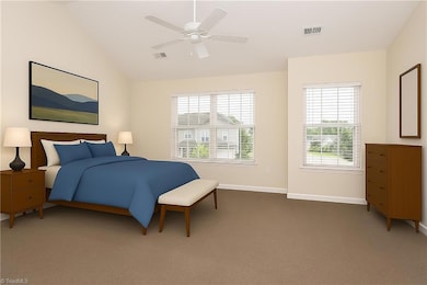 Large primary bedroom, staged