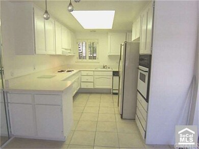 KITCHEN FROM DINING AREA. PLEASANT OUTLOOK FROM WI
