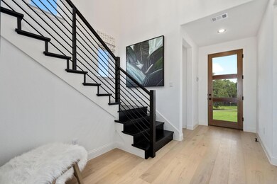 Foyer featuring light hardwood / wood-style floori