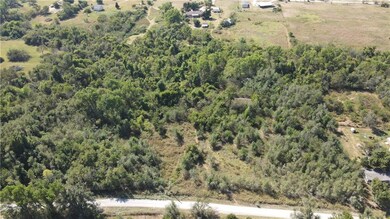 Lot starts to the left of abandoned house