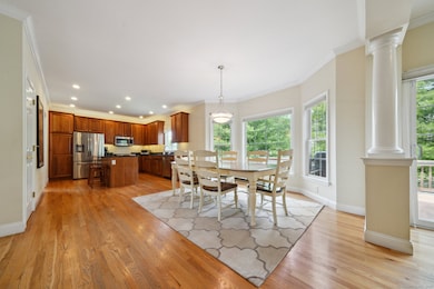 Dining area that leads to the pillared family room