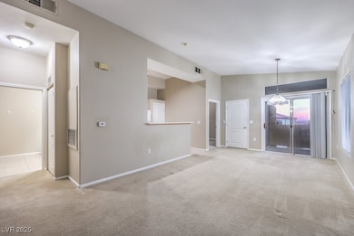 Spare room with carpet floors, lofted ceiling, vis