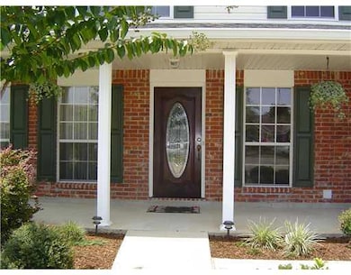 Photo. Leaded glass front door, large porch, nice