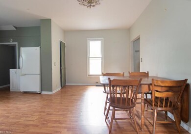 Another kitchen angle. Door on left of window lead