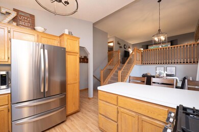 The kitchen opens to the entry and dining area