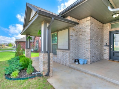 Entrance to property featuring brick siding, a yar