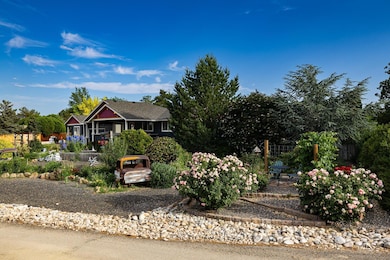 Obstructed view of property featuring view of scattered trees