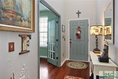 Looking at front door, office to the left