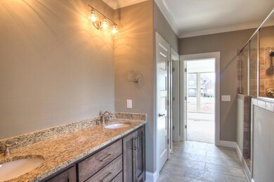 Double vanities, separate tub and large walk-in closet