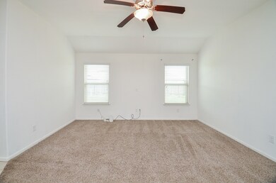 Light & bright living room, open to the kitchen and dining area.
