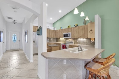 Entryway and hallway to Kitchen with breakfast bar