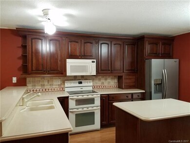 Updated kitchen with island and double oven.