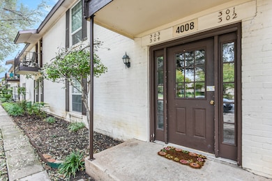 Entrance to property featuring brick siding