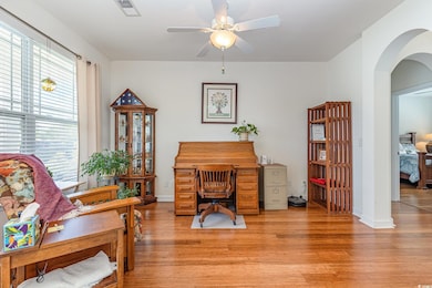 Home office featuring light wood-style floors, ple