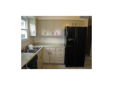 Kitchen has ceramic tile floor.