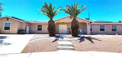 Ranch-style house featuring stucco siding and sola