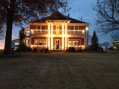 View of front of home featuring covered porch, a b