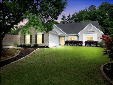 View of front of property featuring brick siding and a shingled roof
