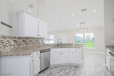 Kitchen with appliances with stainless steel finis