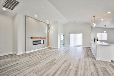 Unfurnished living room featuring a glass covered