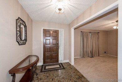Entry way opens up into formal dining area.