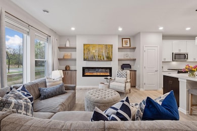 This unit features an electric fireplace and built in cabinets and shelves.