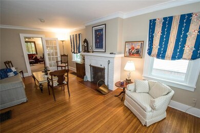VIEW OF LIVING ROOM LEADING INTO THE GREAT ROOM AD