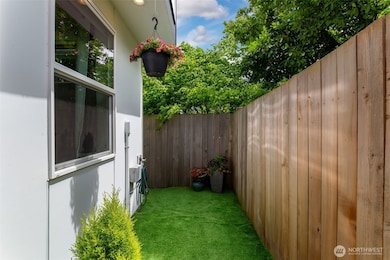This end unit features your own partially fenced private yard area that forms a U, running along the sides and back of the home. It's all yours!