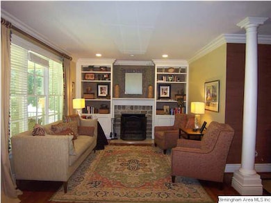 Living room with beautiful cabinetry and fireplace