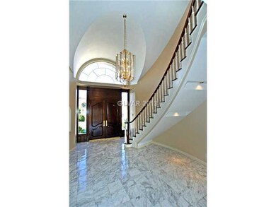 Lobby/Reception. Marble Entry Foyer w/Chandelier &
