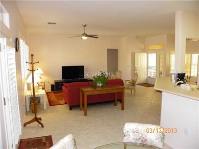 Living Room. Note the high ceiling. Shutters throu