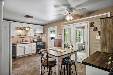 Updated Kitchen with white cabinets and stainless
