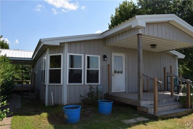 North side of house. Windows are the breakfast/din