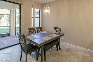 Dining area featuring an inviting chandelier
