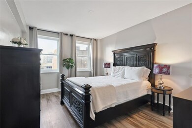 Large bedroom with two large windows