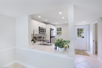 Entryway leading to kitchen and powder bath.