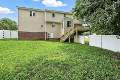 Rear view of property featuring stairway to a Bran