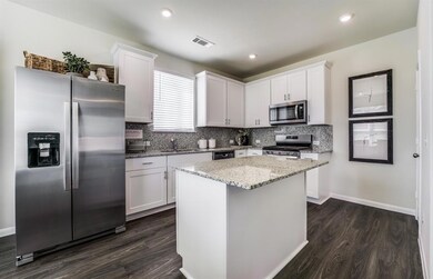 Island Kitchen *Photos of furnished model. Not act