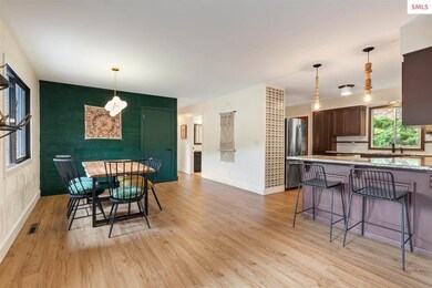 Breakfast bar that opens to the dining room and wa