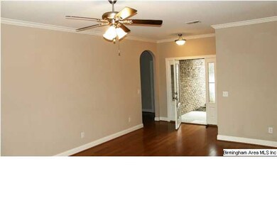GREAT ROOM WITH HARDWOOD FLOORING TO THE FOYER AND