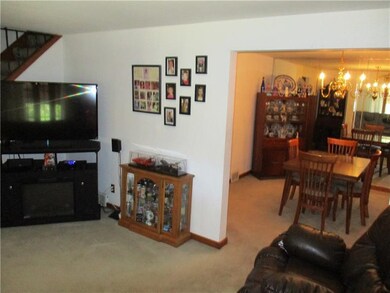 Living room flows into the formal dining room.